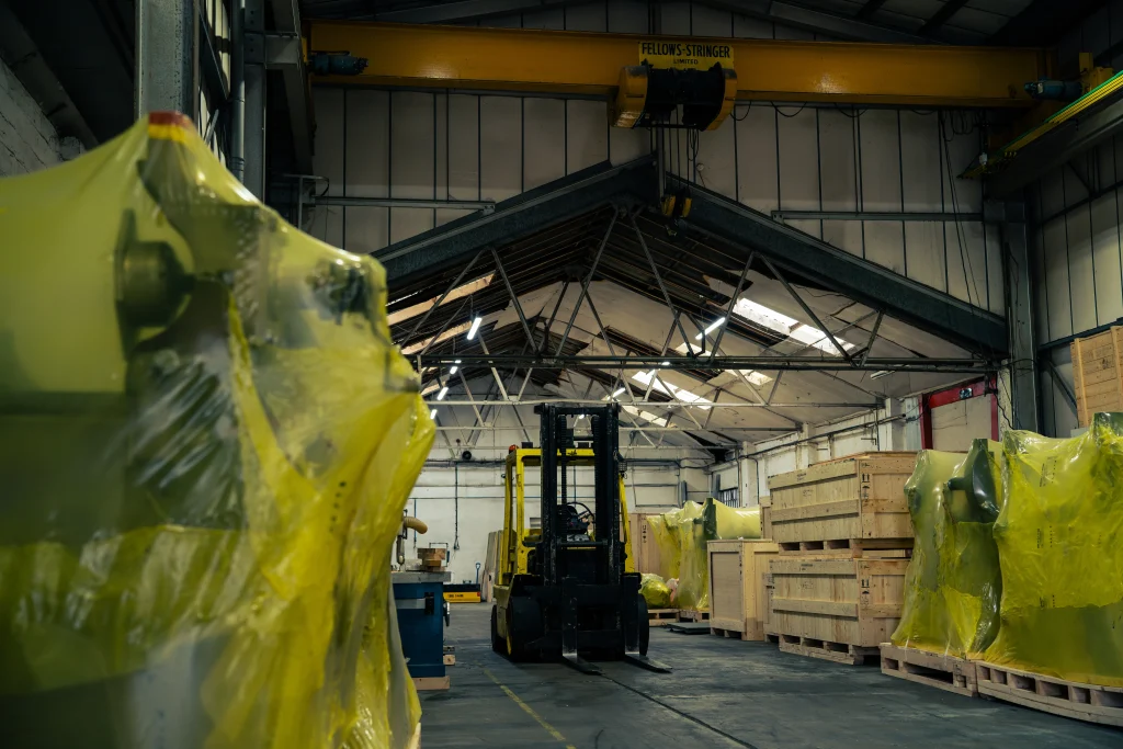 VCI-wrapped machinery stored inside IM Export Services warehouse.
