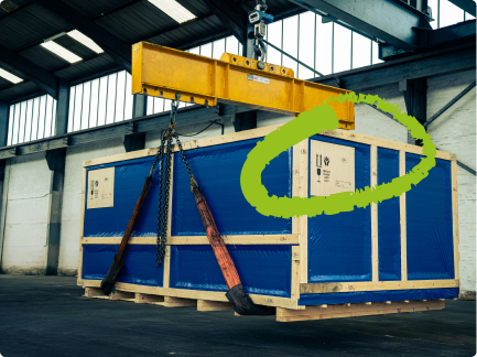 Heavy machinery stored in a bespoke timber case inside our UK export packing and storage facility