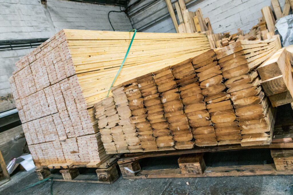 Stacked timber wood pieces in the IM Export Services facility